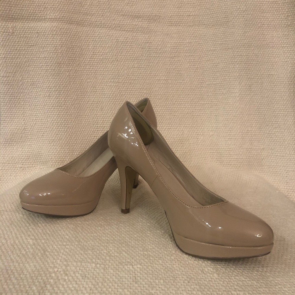 Nude Nickels patent leather platform pumps.